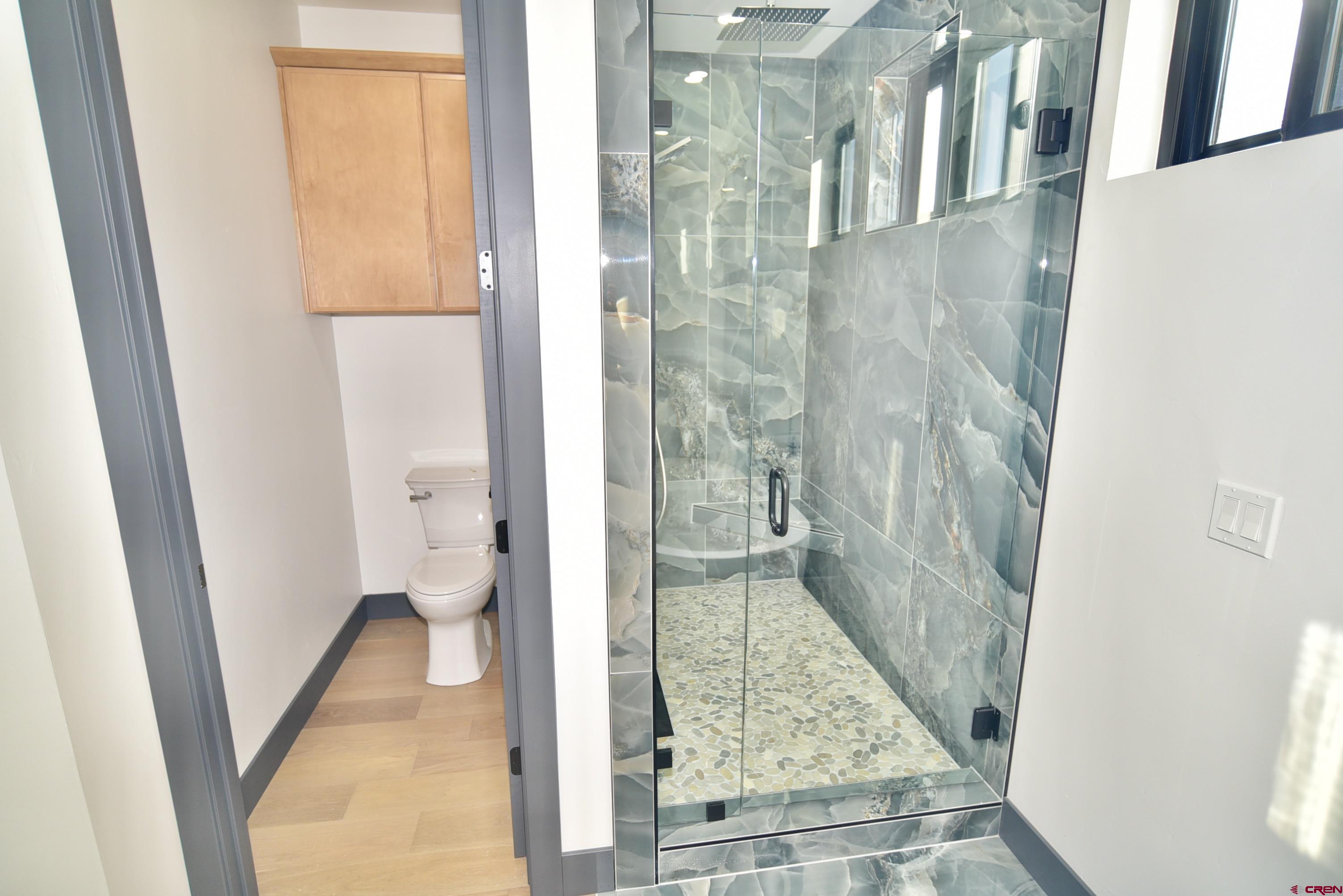 1508 Criterion Street Delta, CO 81416 - Photo 15 of 27 a bathroom with a glass door shower and a sink