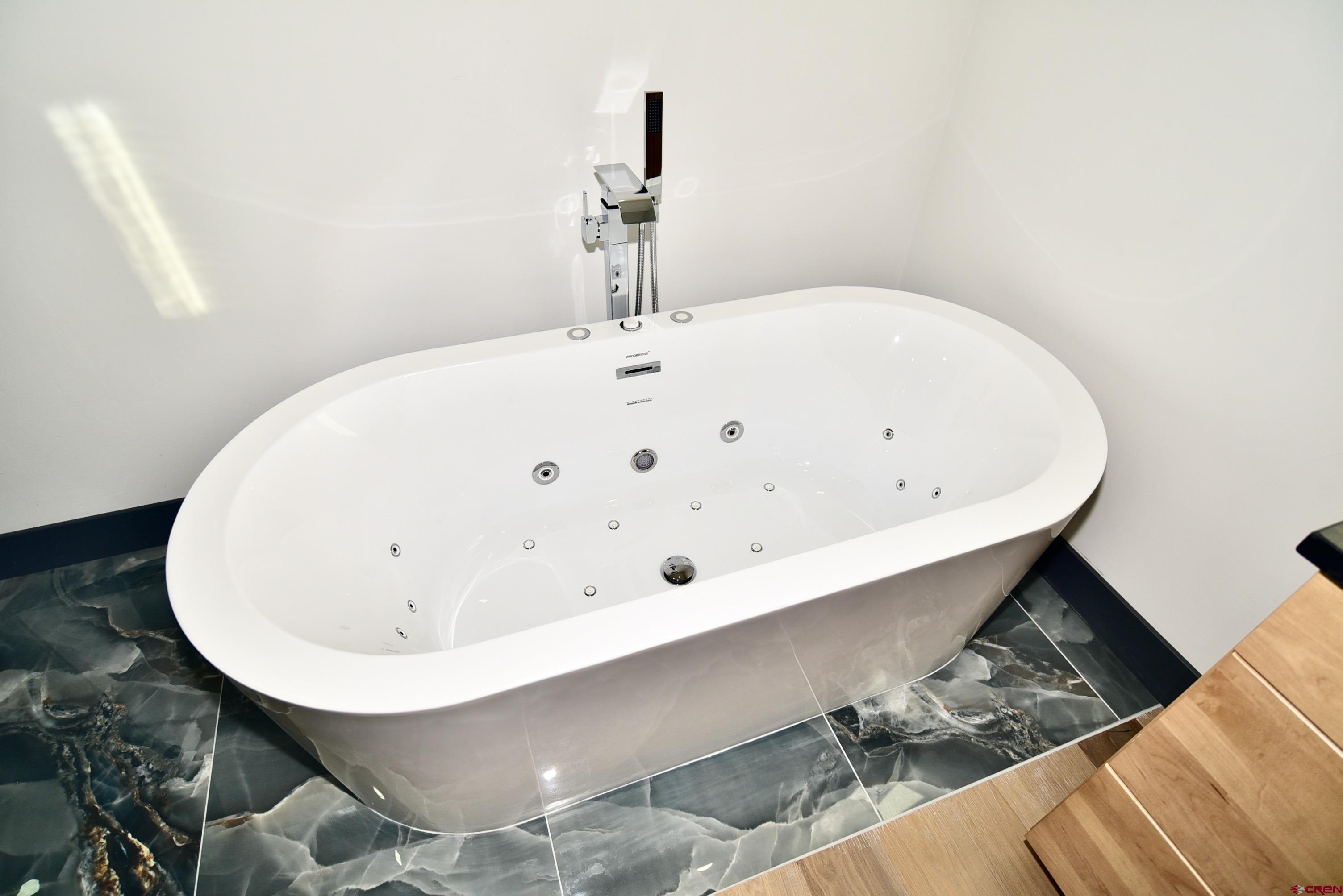 1508 Criterion Street Delta, CO 81416 - Photo 16 of 27 a bathroom with a bathtub