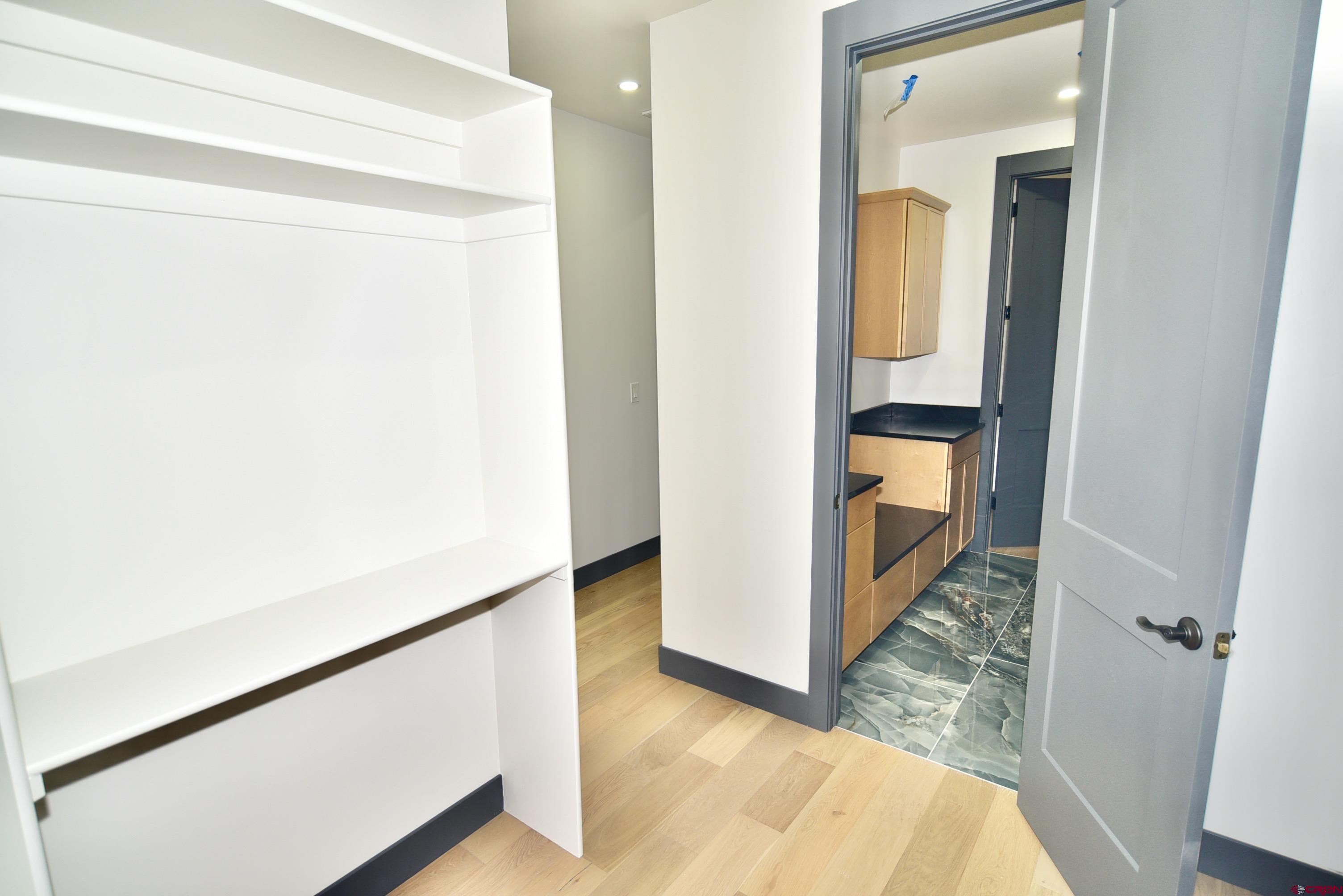 1508 Criterion Street Delta, CO 81416 - Photo 18 of 27 a view of a hallway with wooden floor and staircase
