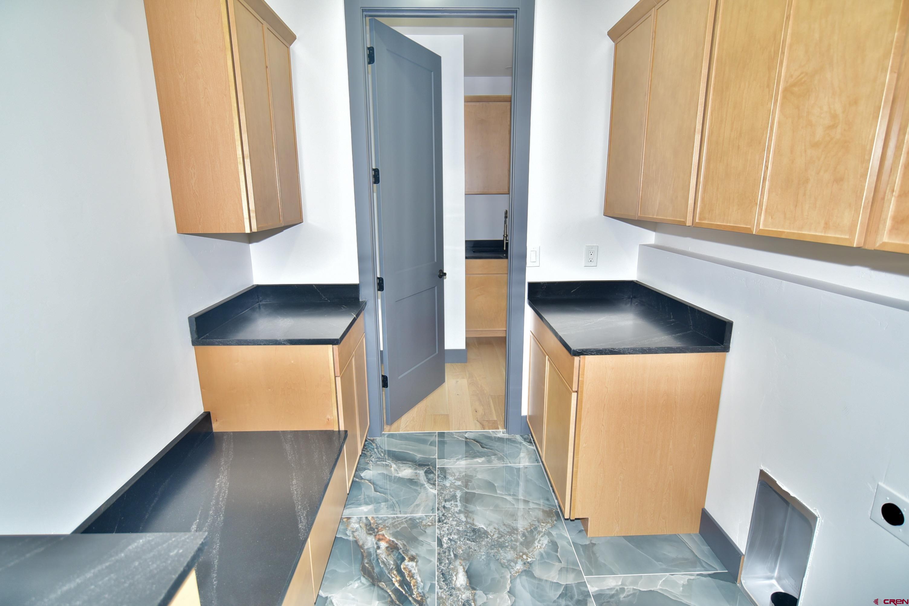 1508 Criterion Street Delta, CO 81416 - Photo 19 of 27 a view of hallway with washer and dryer