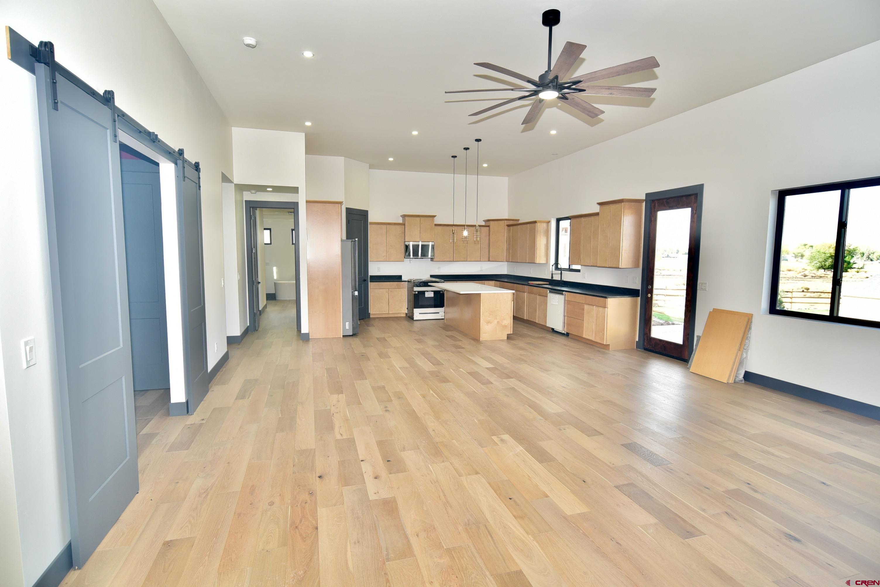 1508 Criterion Street Delta, CO 81416 - Photo 2 of 27 a view of a kitchen with a sink and a refrigerator