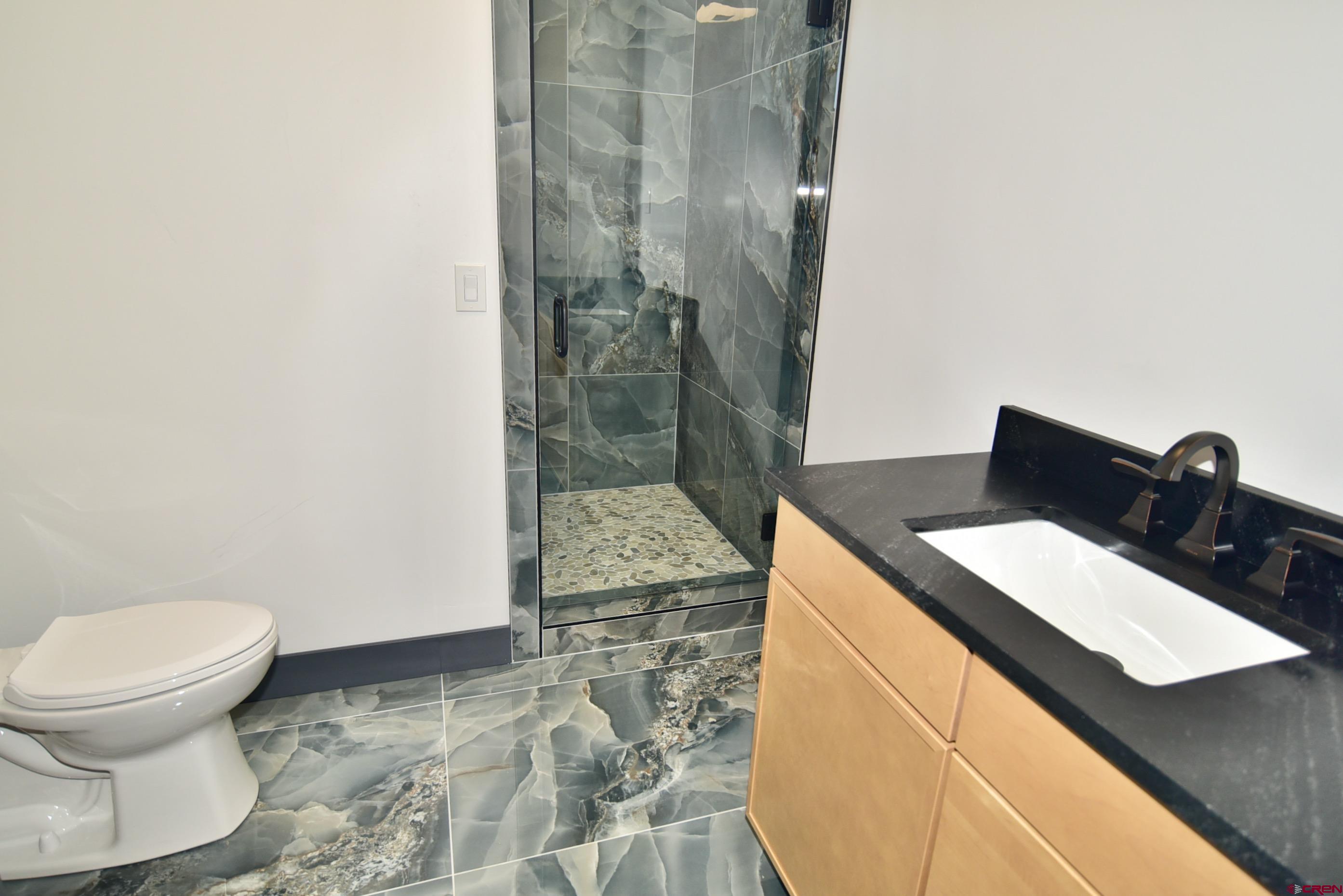 1508 Criterion Street Delta, CO 81416 - Photo 23 of 27 a bathroom with a sink and a toilet