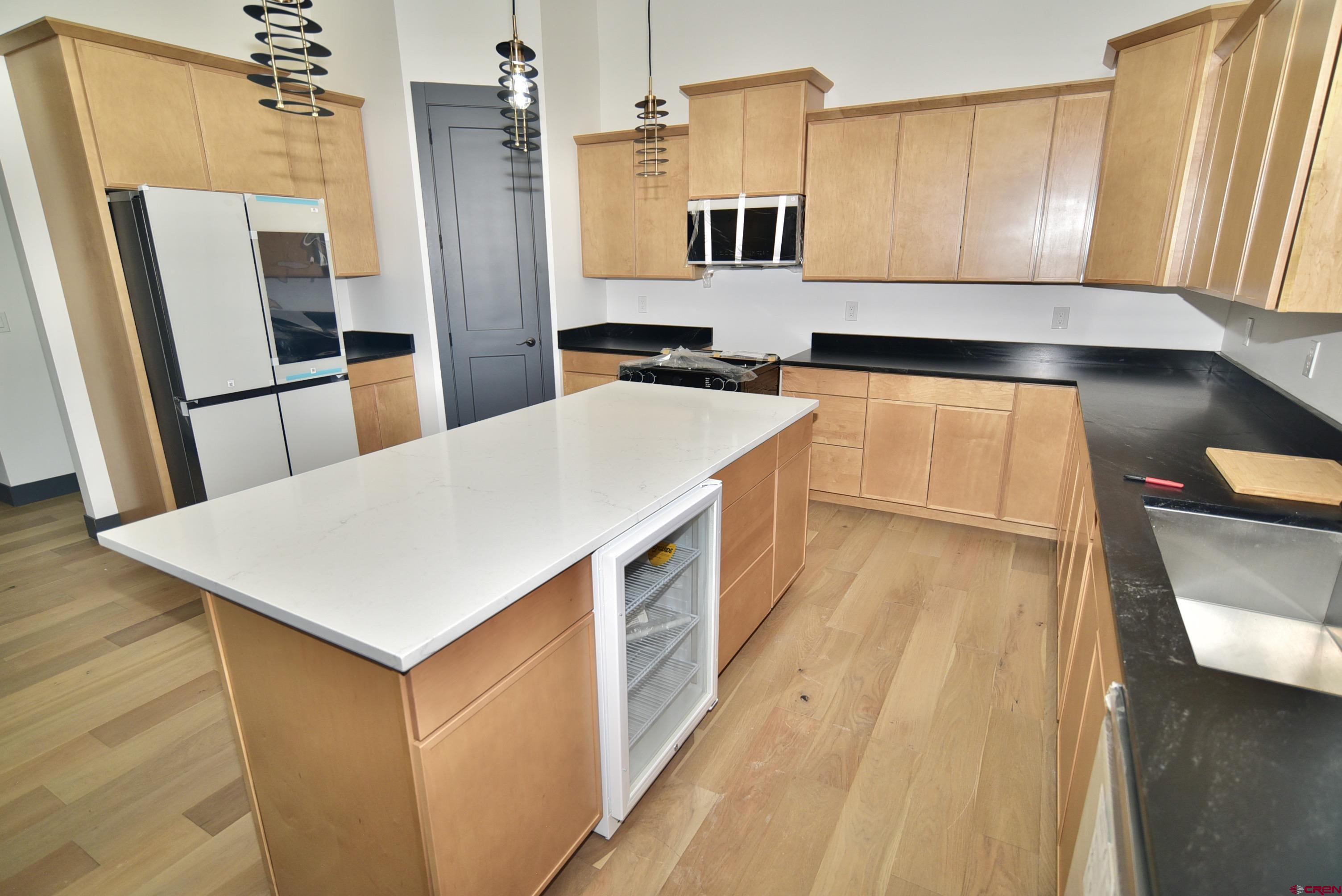 1508 Criterion Street Delta, CO 81416 - Photo 3 of 27 a kitchen with a sink a counter top space and stainless steel appliances