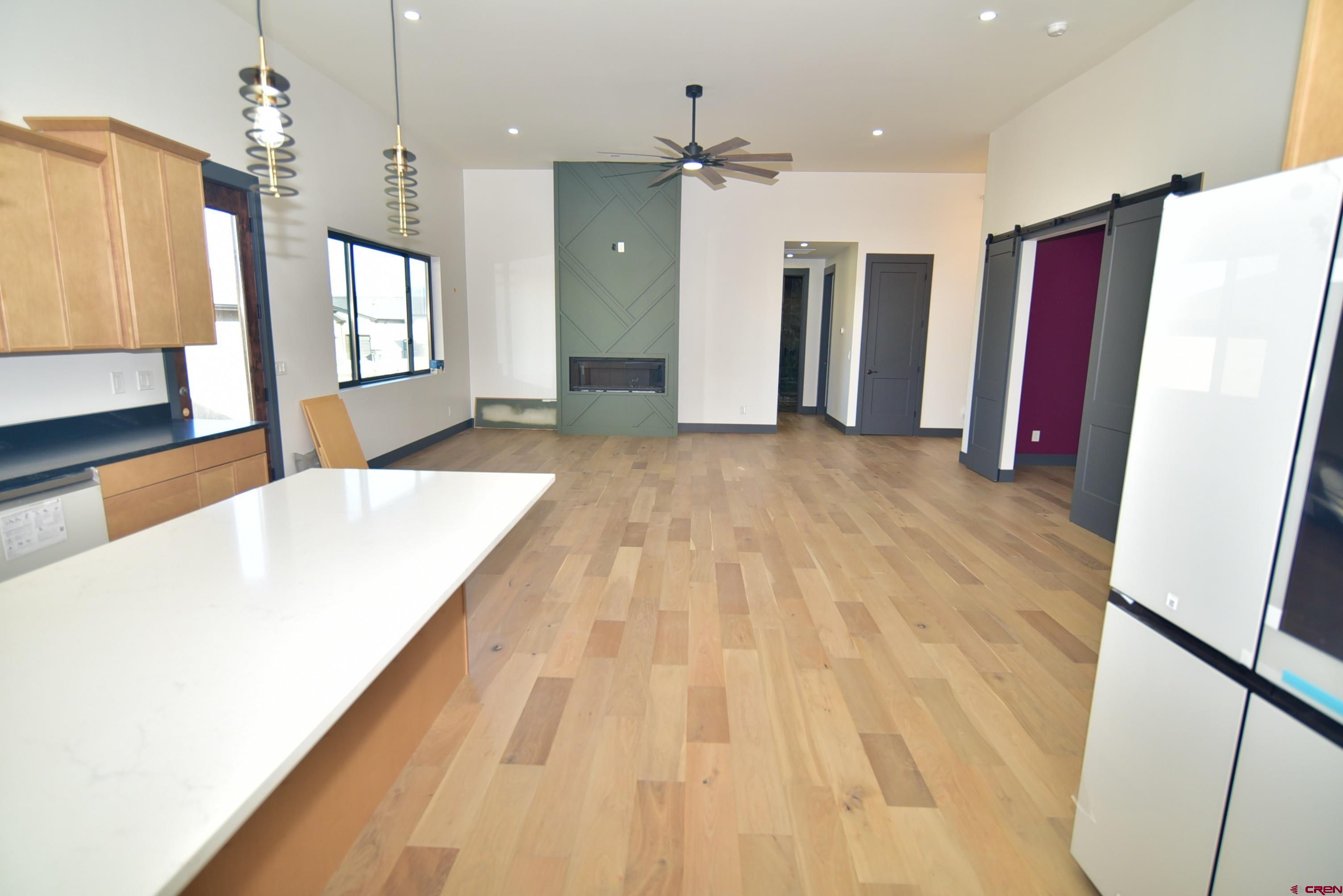 1508 Criterion Street Delta, CO 81416 - Photo 5 of 27 a view of a kitchen with refrigerator and wooden floor
