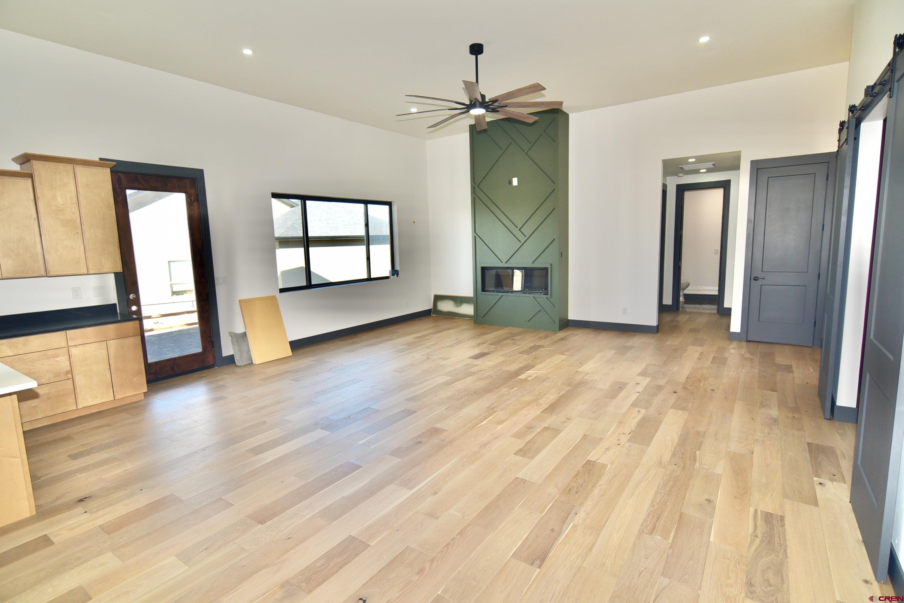 1508 Criterion Street Delta, CO 81416 - Photo 7 of 27 a view of an empty room with window and wooden floor