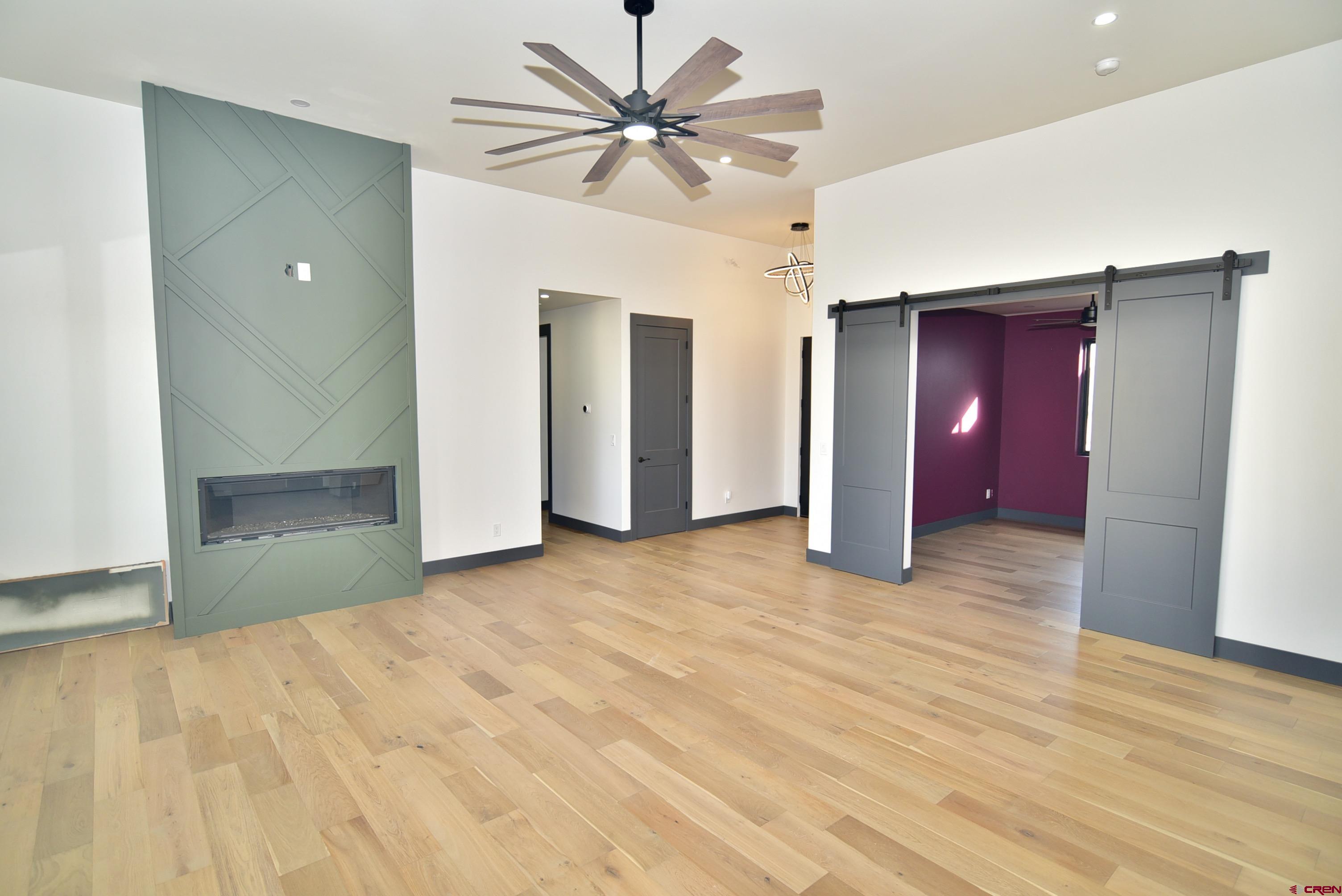 1508 Criterion Street Delta, CO 81416 - Photo 8 of 27 a view of a livingroom with a chandelier fan