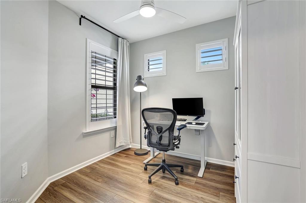 2240 Yellowfin Circle Naples, FL 34114 - Photo 17 of 38 Flex room with luxury vinyl flooring, plantation shutters and impact windows