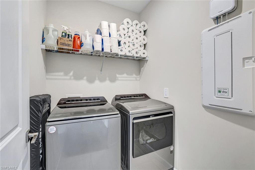 2240 Yellowfin Circle Naples, FL 34114 - Photo 18 of 38 Washroom featuring washing machine and gas dryer