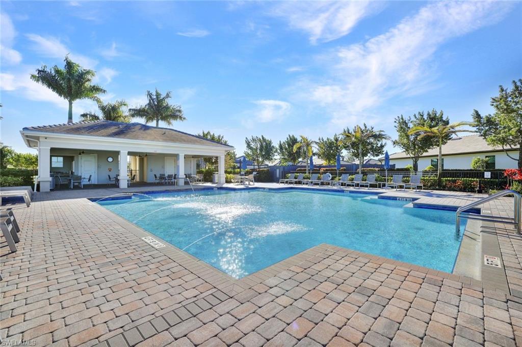 2240 Yellowfin Circle Naples, FL 34114 - Photo 27 of 38 Community pool featuring a patio area and grilling space