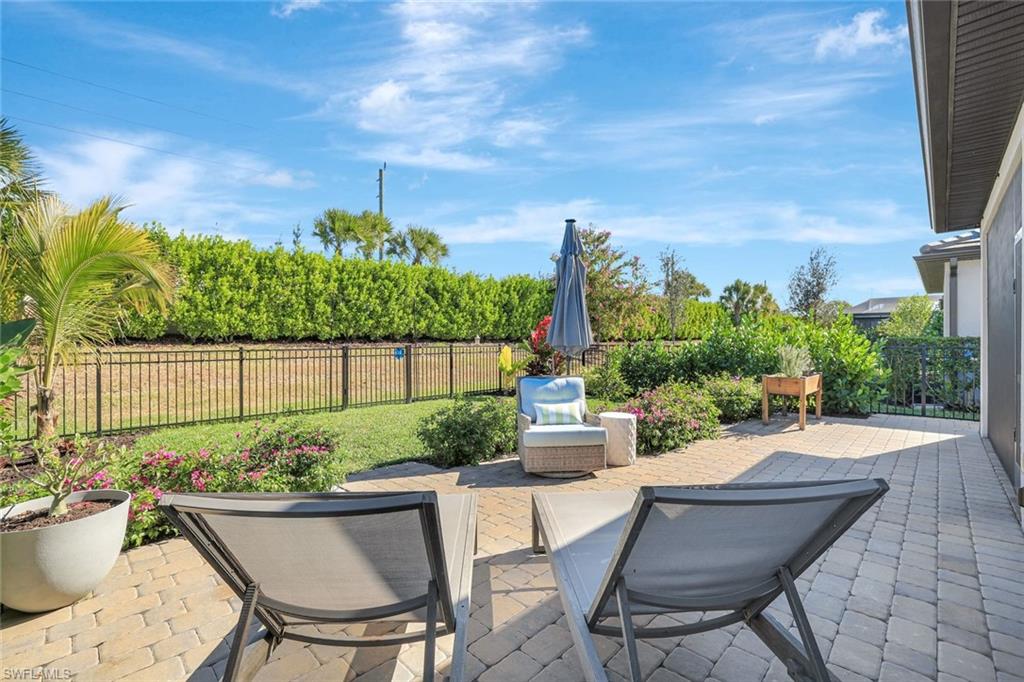 2240 Yellowfin Circle Naples, FL 34114 - Photo 3 of 38 Fenced backyard with a patio area