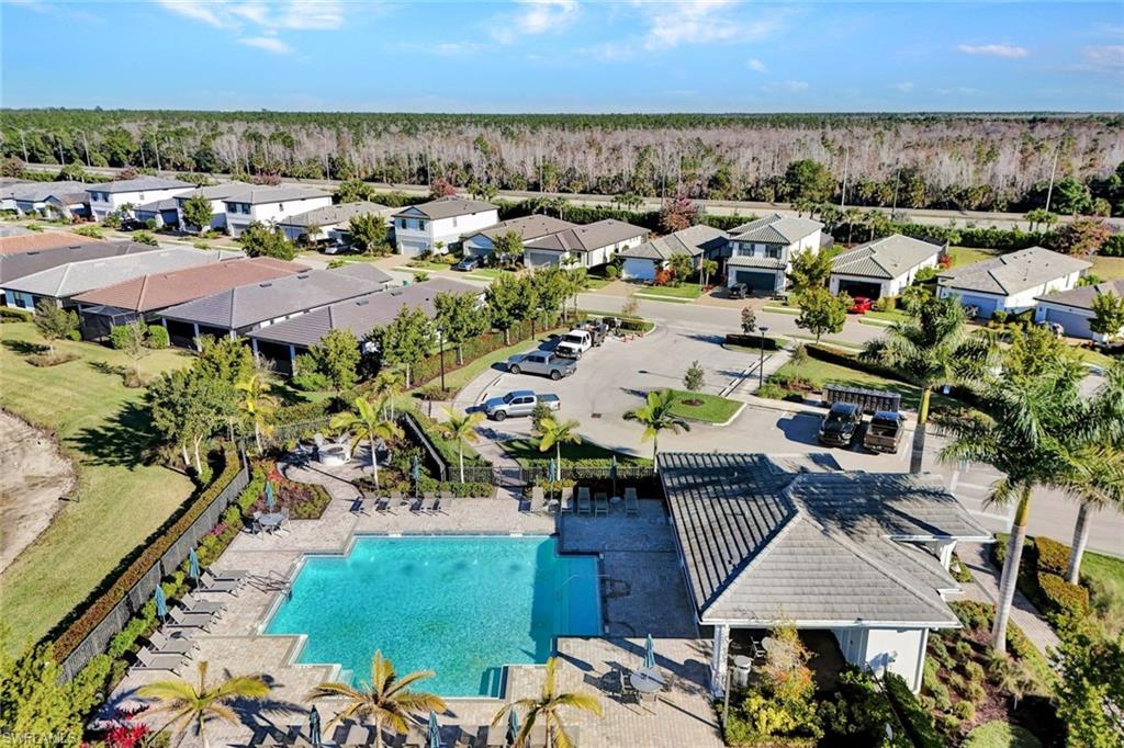 2240 Yellowfin Circle Naples, FL 34114 - Photo 33 of 38 Aerial view of residential area featuring a community pool, fire pit, grilling area and cabana