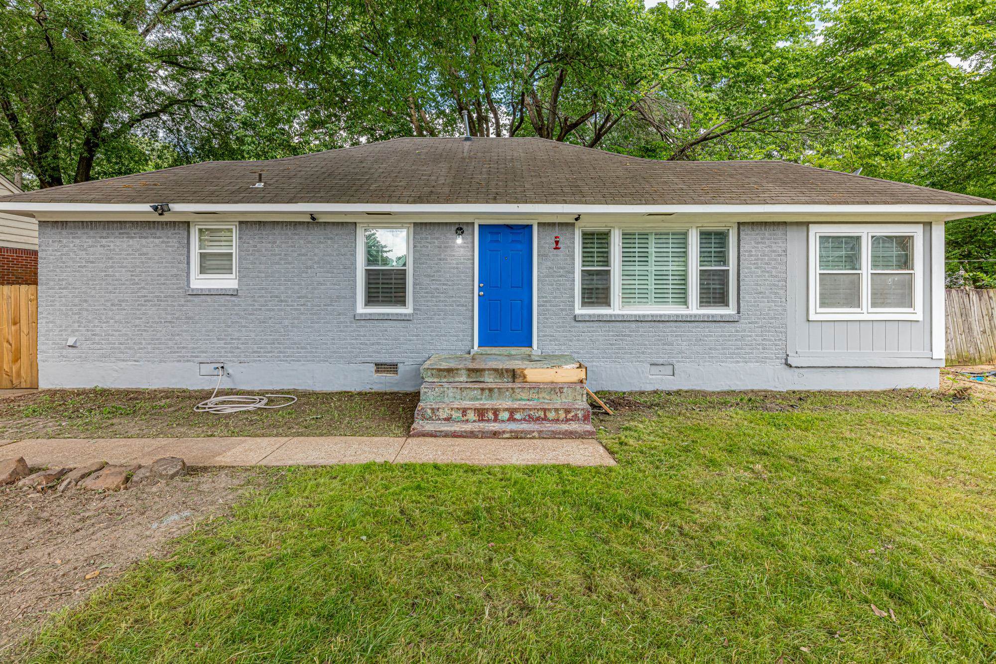 1349 South Perkins Road Memphis, TN 38117 - Photo 1 of 17 a front view of a house with a yard