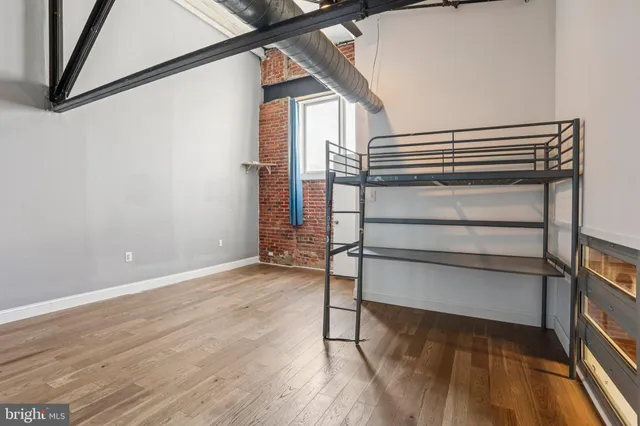 an aerial view of residential house with wooden floor