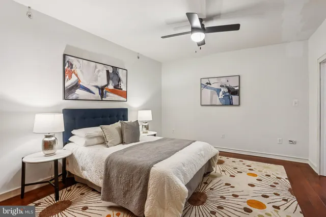 a bedroom with a large bed and a balcony