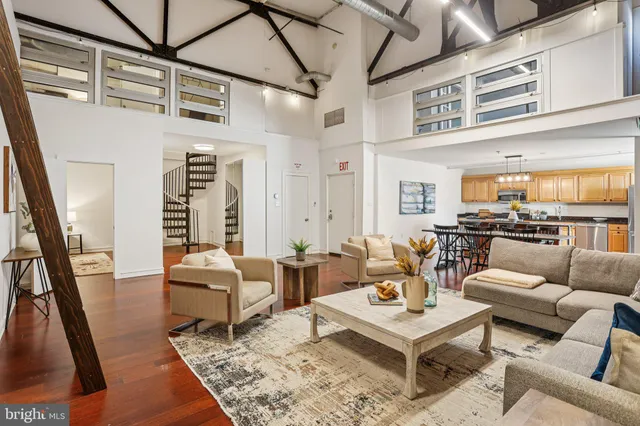 a living room with furniture and a rug