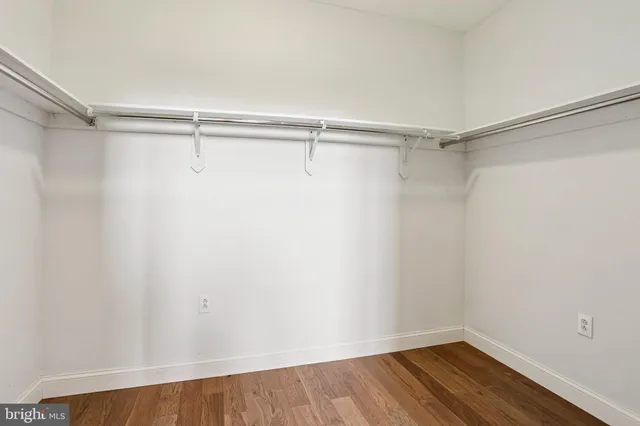a view of wooden staircase with white walls