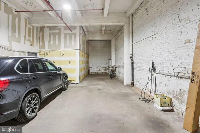 a front view of a building with a parking space