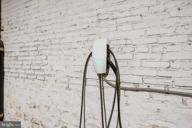 a front view of a building with a garden