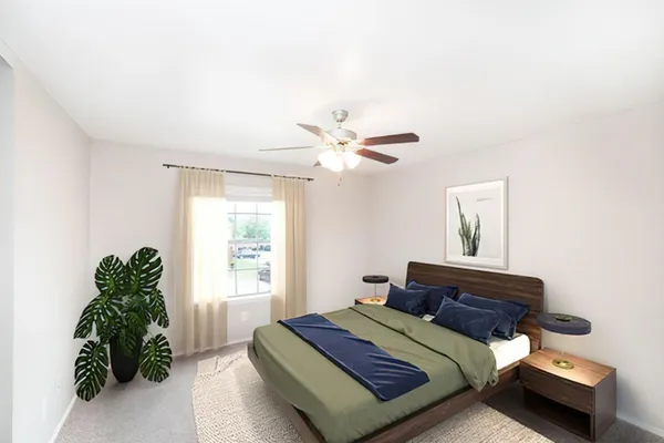 a bedroom with a bed and a window