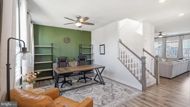 a workspace with furniture window and wooden floor