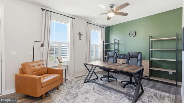 a work room with furniture and a window
