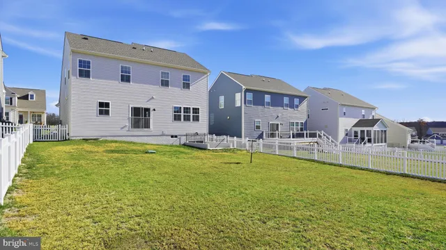a swimming pool view with a outdoor seating