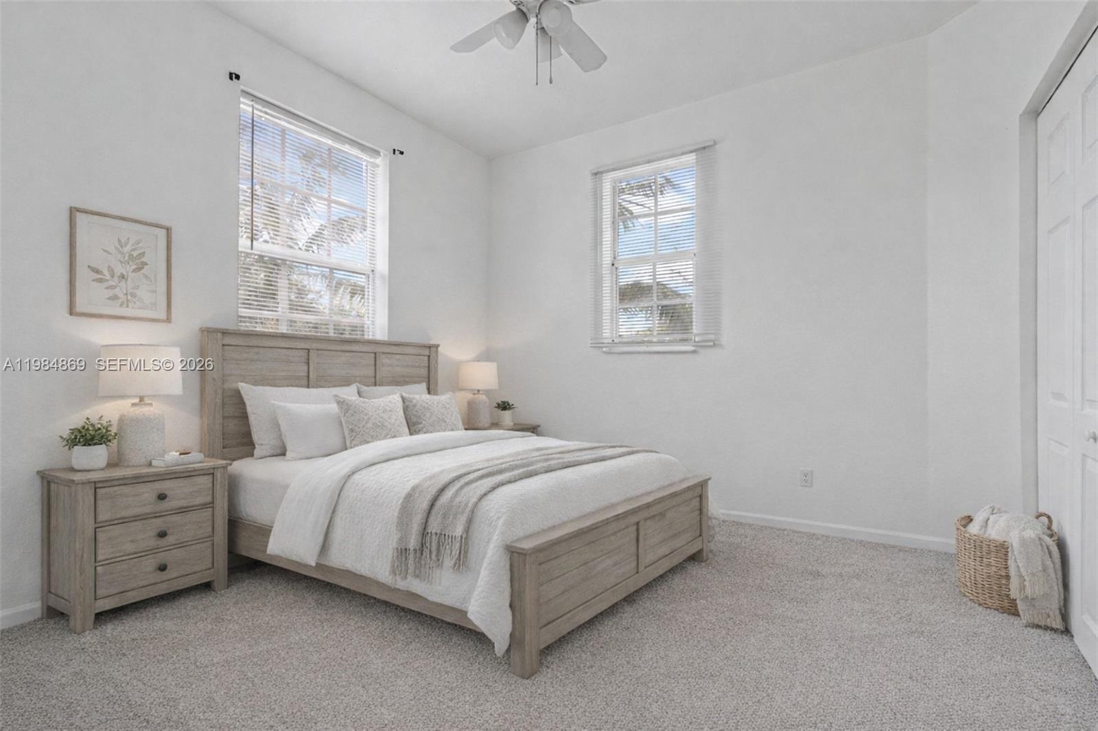 2109 Northeast 3rd Court Homestead, FL 33033 - Photo 14 of 19 a bedroom with a bed and a window
