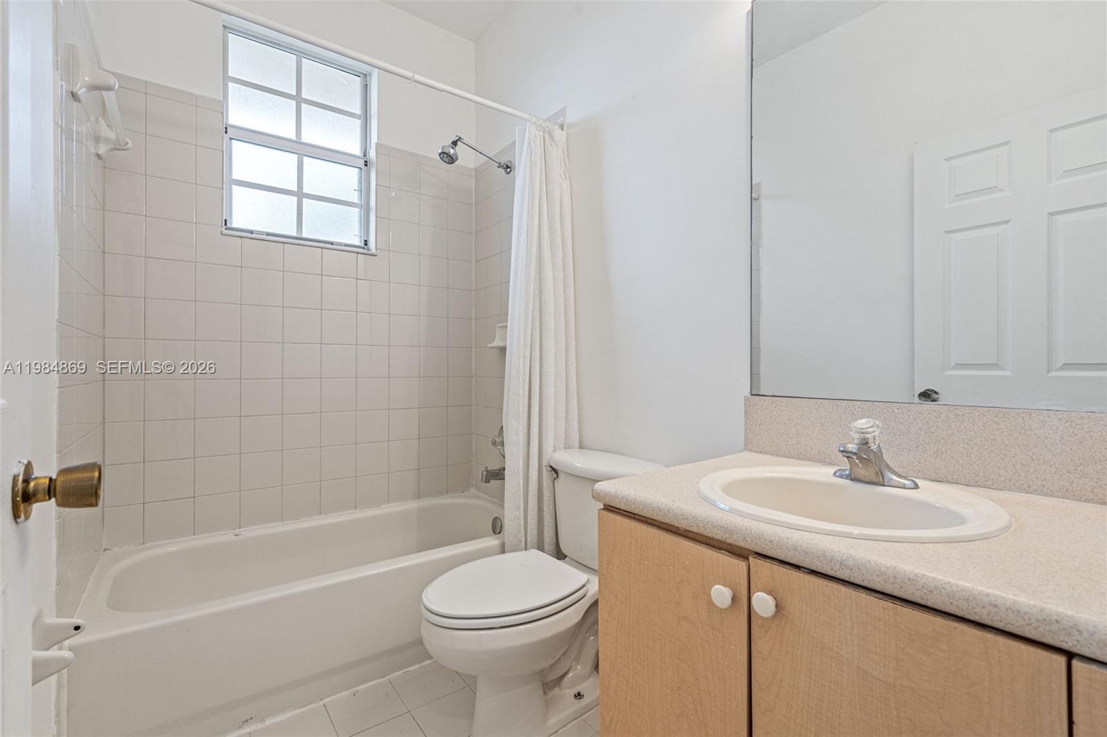 2109 Northeast 3rd Court Homestead, FL 33033 - Photo 15 of 19 a bathroom with a sink a toilet and shower
