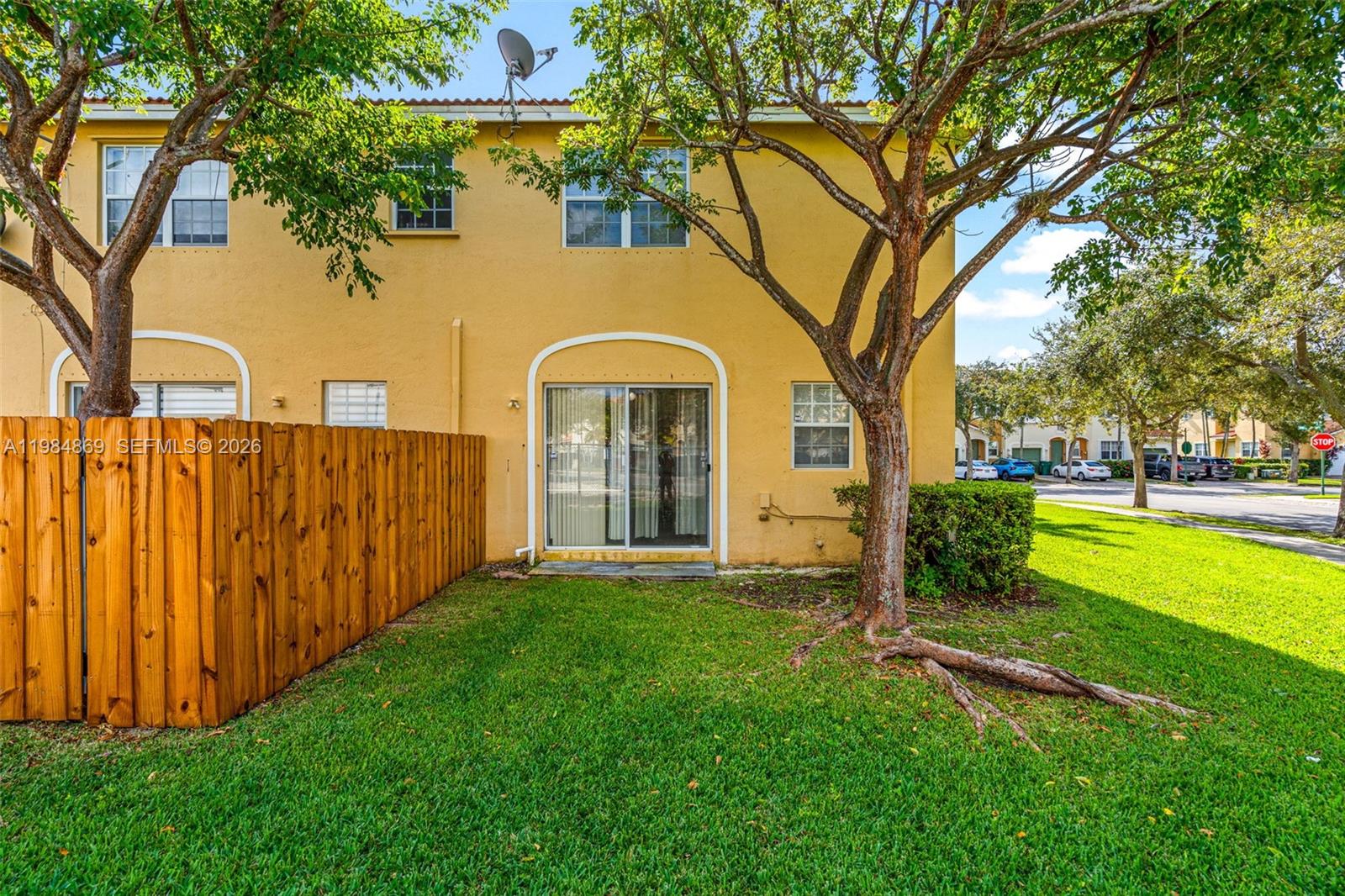 2109 Northeast 3rd Court Homestead, FL 33033 - Photo 17 of 19 a view of a house with garden and trees
