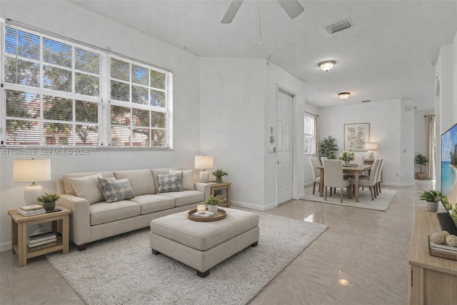 2109 Northeast 3rd Court Homestead, FL 33033 - Photo 4 of 19 a living room with furniture and a table