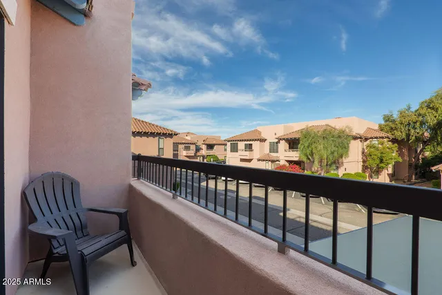 a view of balcony with furniture