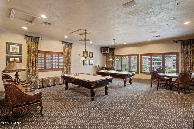 a living room with furniture a window and a table