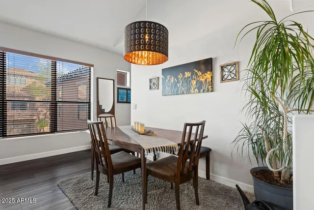 a view of a dining room with furniture and window