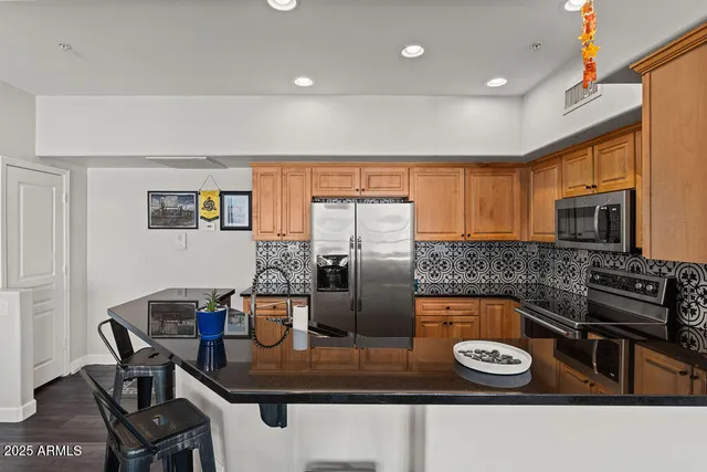 a kitchen with a stove and a refrigerator
