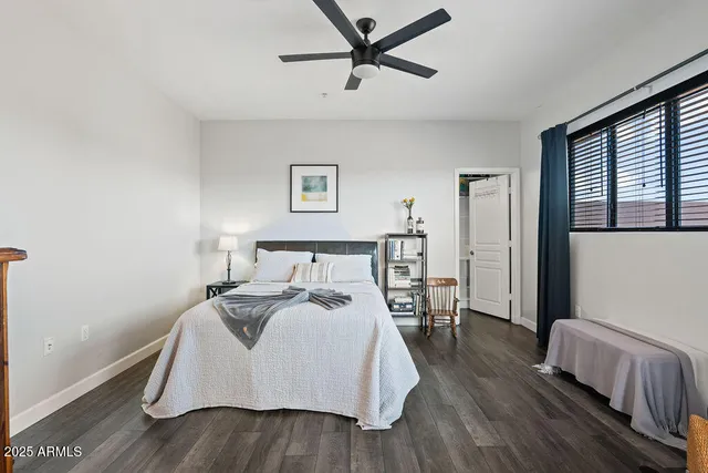 a bed room with bed and a window