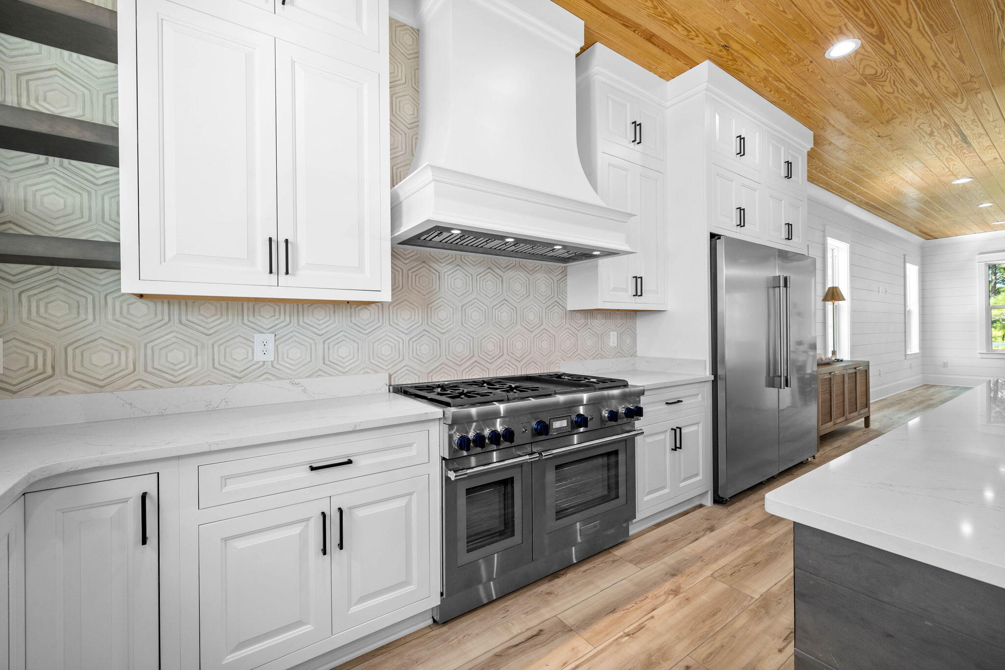 169 Baird Road Santa Rosa Beach, FL 32459 - Photo 17 of 93 a kitchen with stainless steel appliances granite countertop a stove a sink and a refrigerator