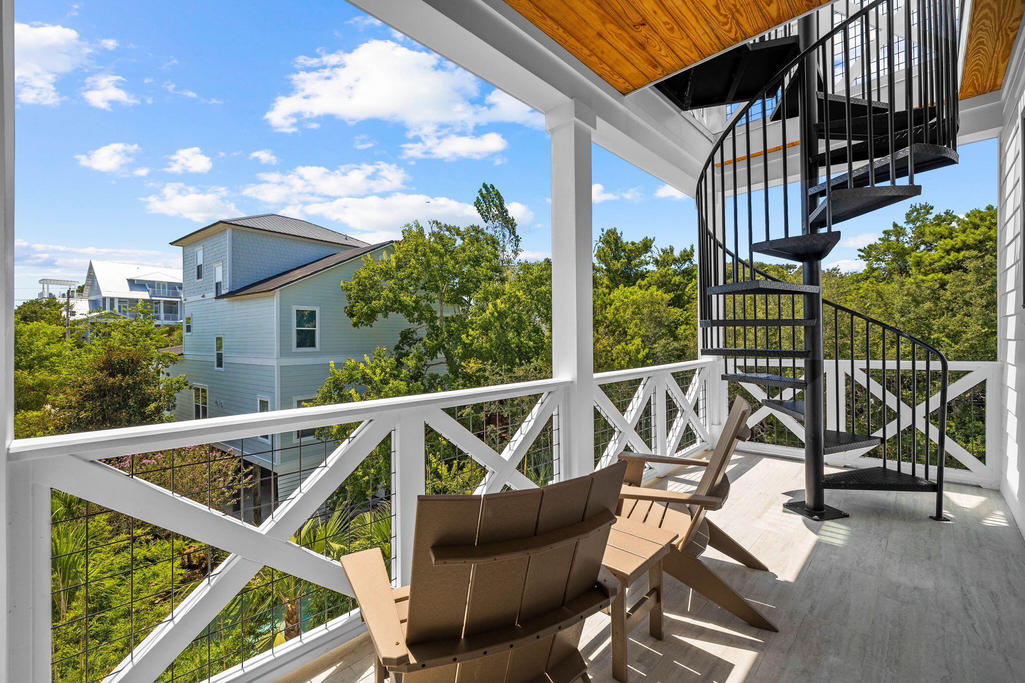 169 Baird Road Santa Rosa Beach, FL 32459 - Photo 30 of 93 a view of a chair and tables in the balcony