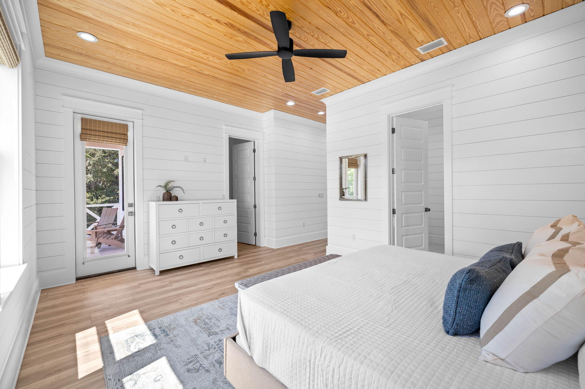 169 Baird Road Santa Rosa Beach, FL 32459 - Photo 34 of 93 a bedroom with a bed and a chandelier