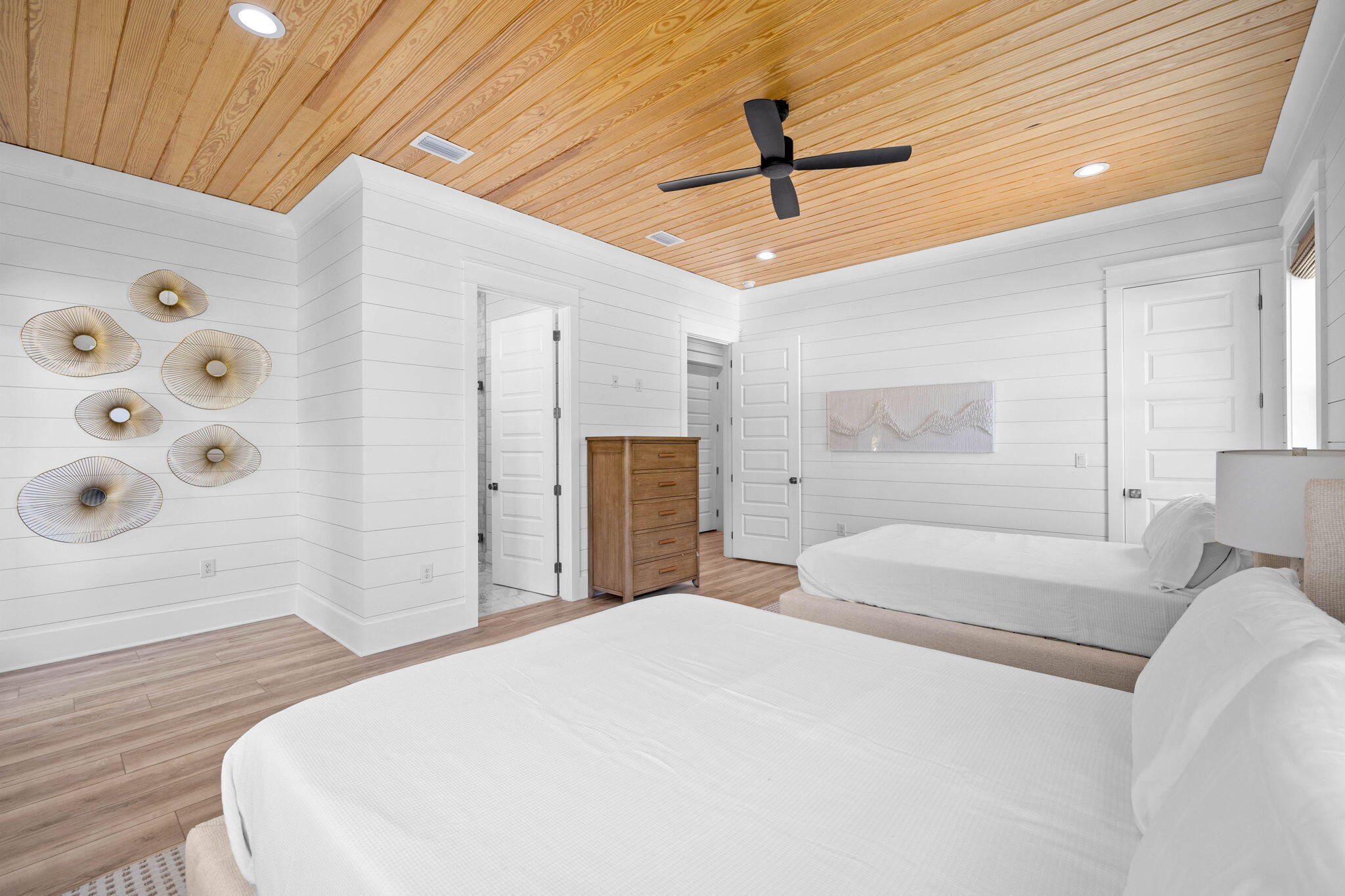 169 Baird Road Santa Rosa Beach, FL 32459 - Photo 42 of 93 a bedroom with a large bed and a chandelier