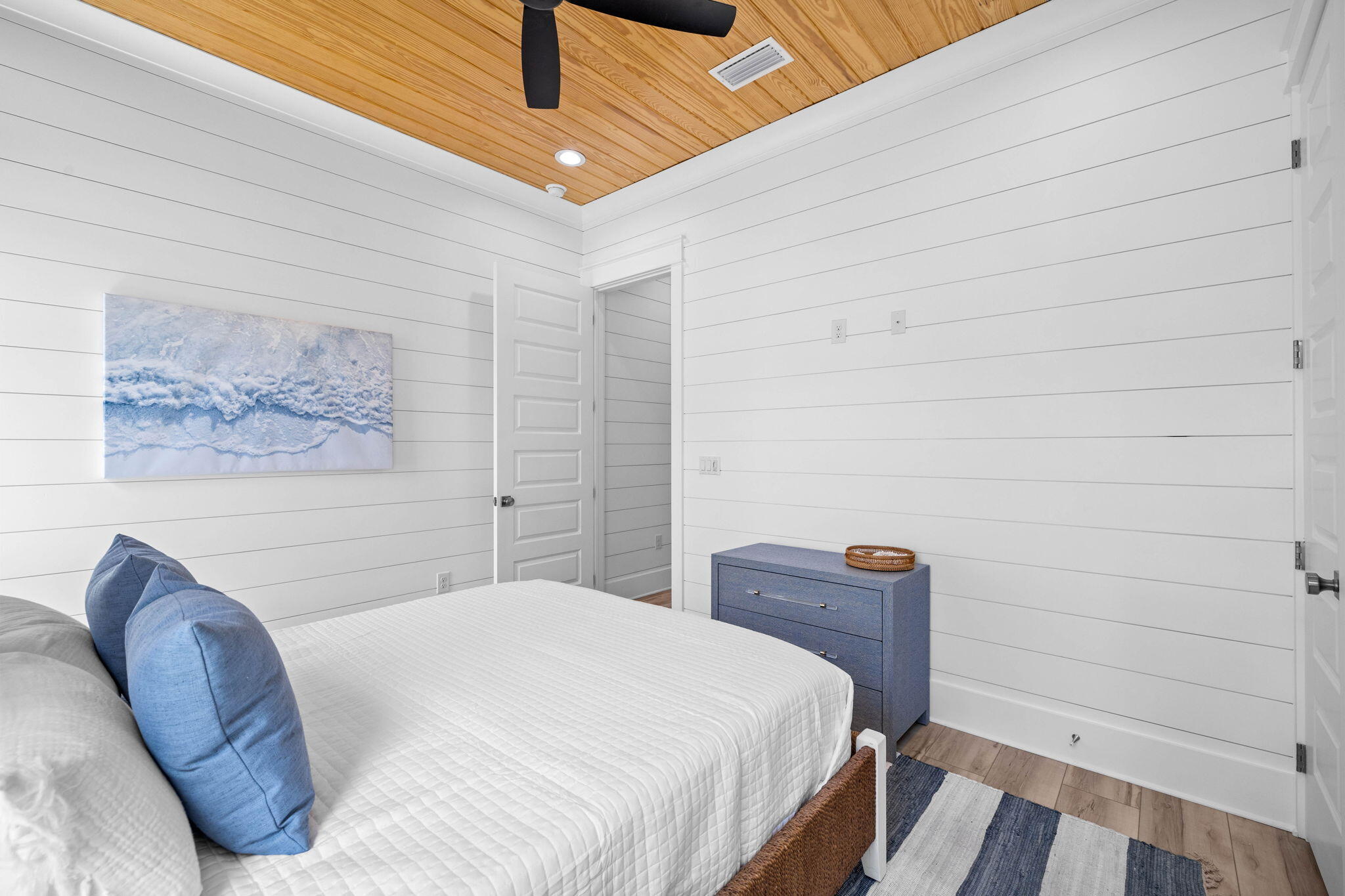 169 Baird Road Santa Rosa Beach, FL 32459 - Photo 61 of 93 a bedroom with a bed and a painting on the wall