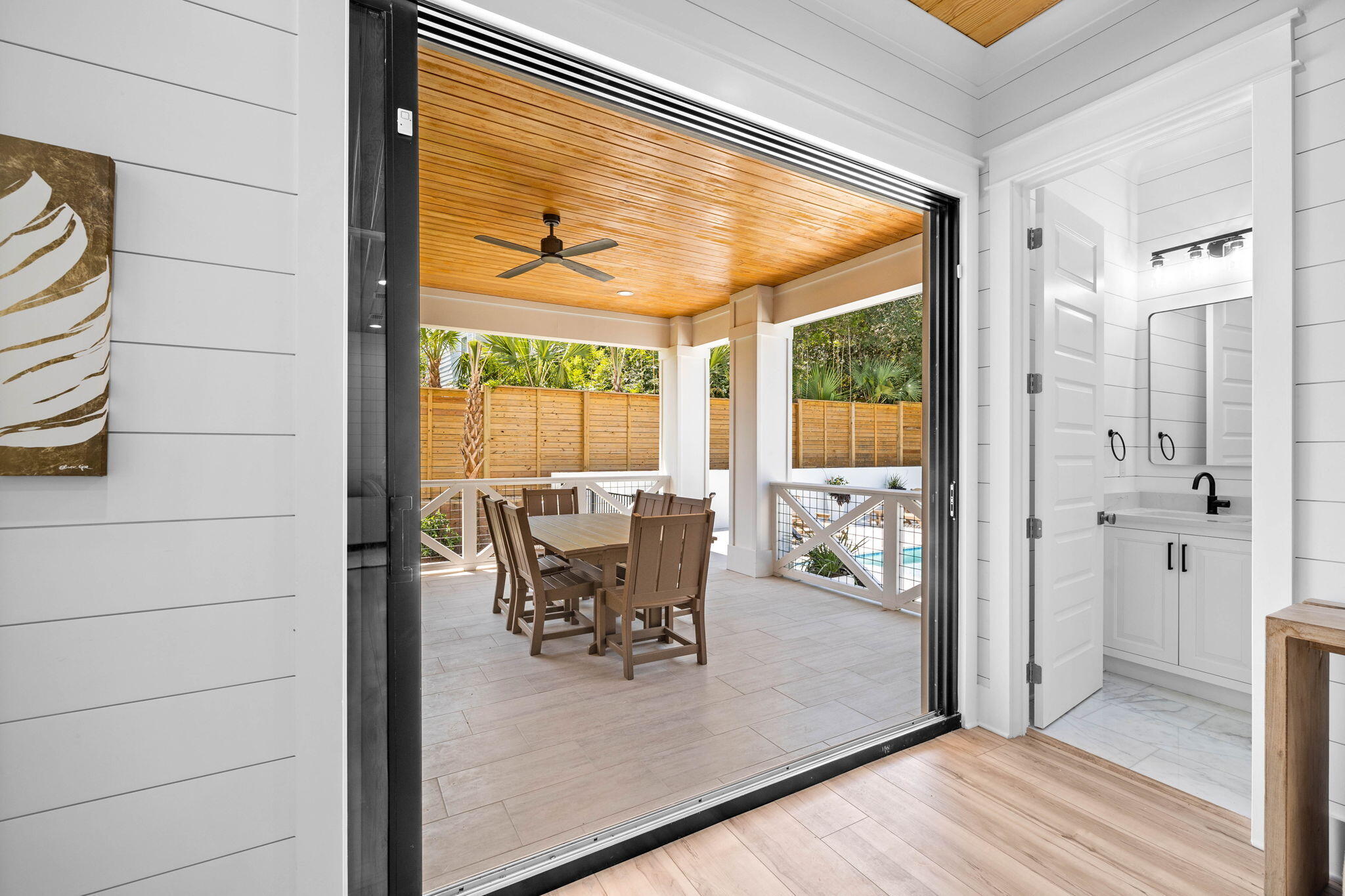 169 Baird Road Santa Rosa Beach, FL 32459 - Photo 64 of 93 a dining room with wooden floor and a table