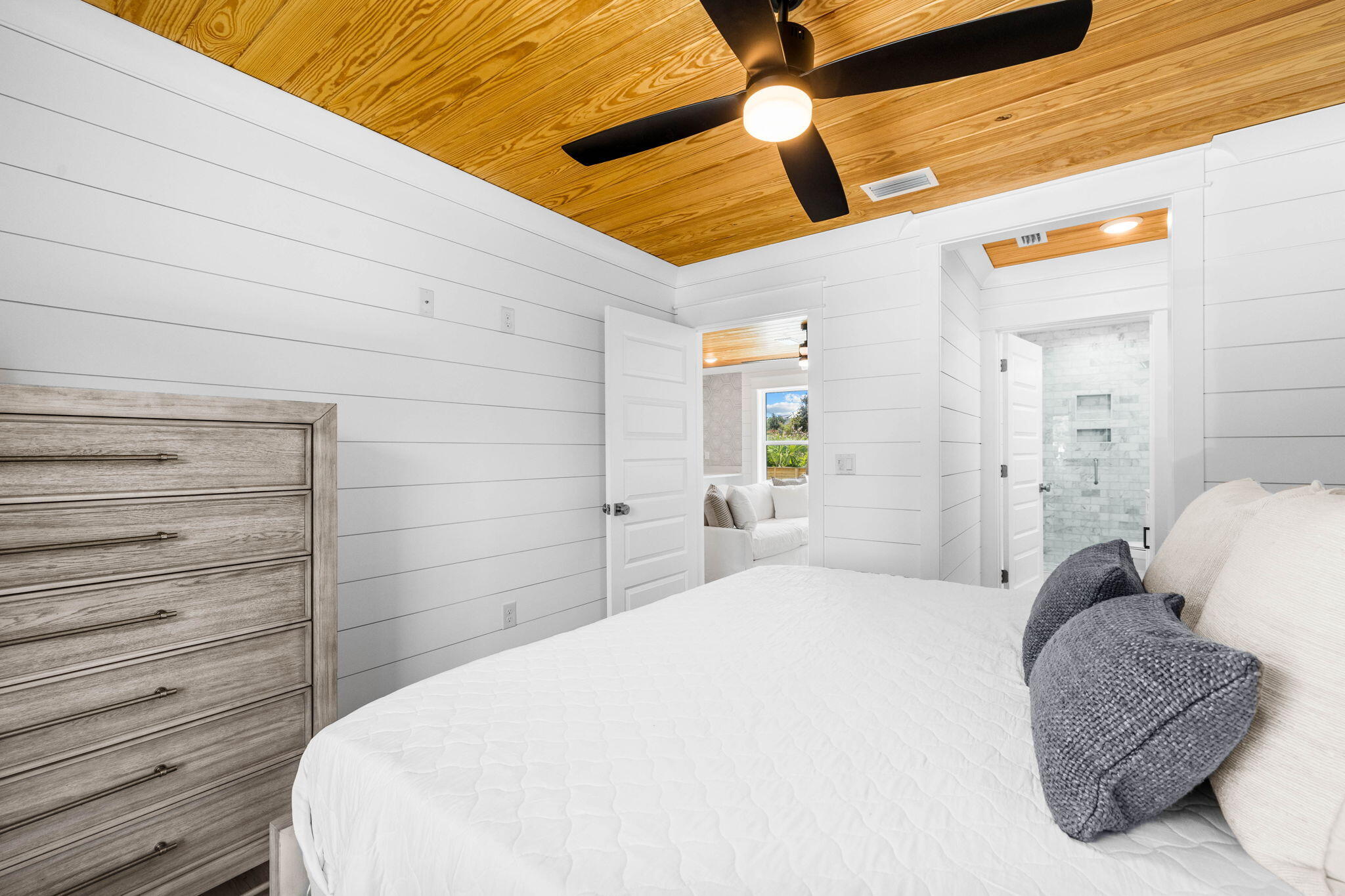 169 Baird Road Santa Rosa Beach, FL 32459 - Photo 83 of 93 a spacious bedroom with a bed and a cabinets