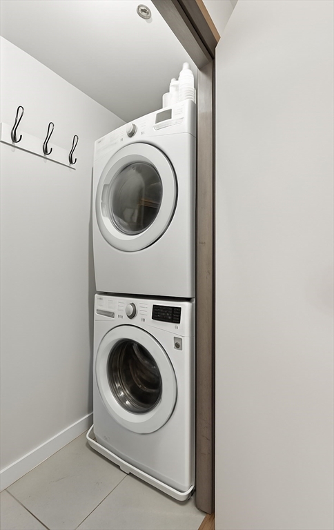 121 Beach Boston Ma, Unit 502 Boston, MA 02111 - Photo 20 of 21 a utility room with dryer and washer