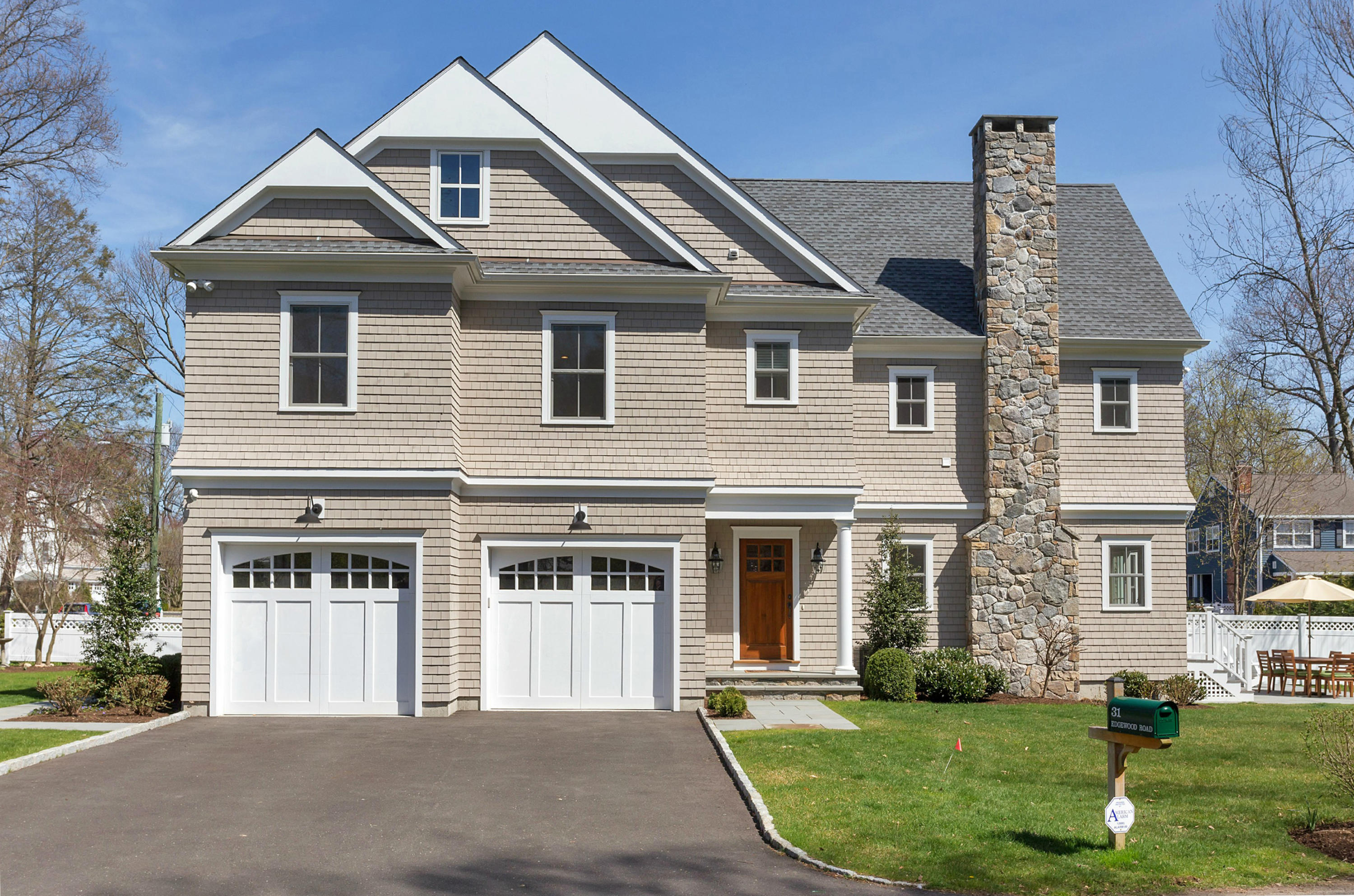 31 Edgewood Road Darien, CT 06820 - Photo 1 of 25 a front view of a house with a yard