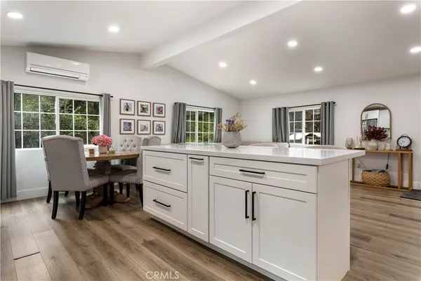 a bathroom with a granite countertop sink a toilet and a mirror