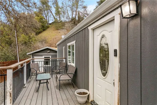 an aerial view of a house with a yard and potted plants