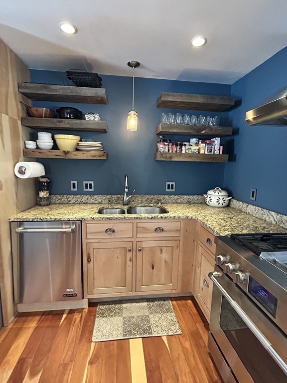 552 Dwight Road Springfield, MA 01108 - Photo 18 of 33 a kitchen with stainless steel appliances granite countertop a stove and a sink