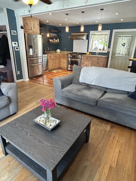 552 Dwight Road Springfield, MA 01108 - Photo 5 of 33 a living room with furniture and a wooden floor