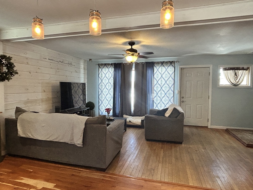 552 Dwight Road Springfield, MA 01108 - Photo 6 of 33 a living room with furniture and a fireplace