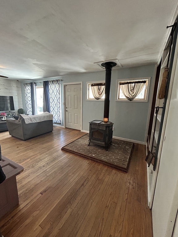 552 Dwight Road Springfield, MA 01108 - Photo 9 of 33 a living room with furniture and a flat screen tv